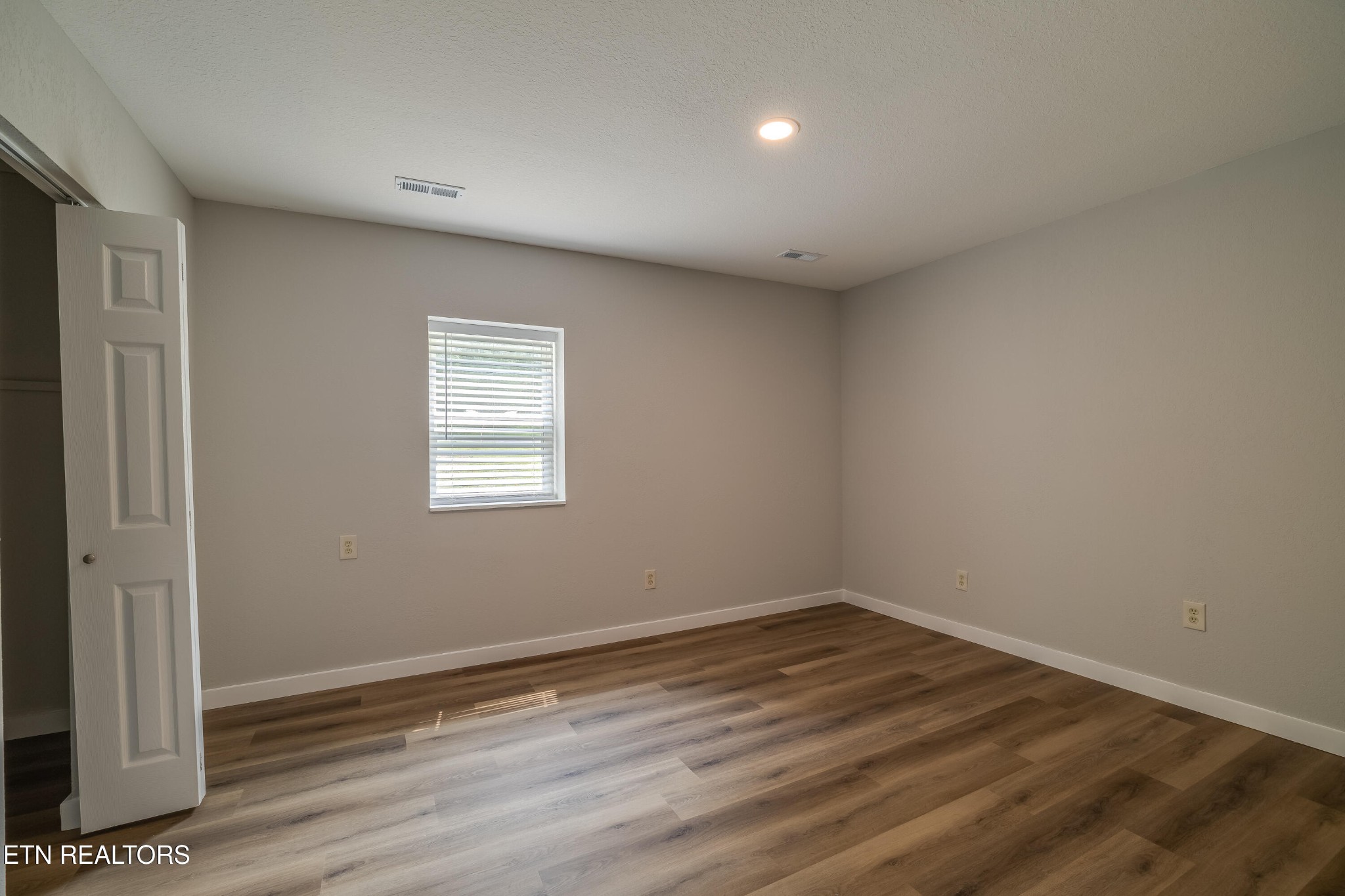 4707 Wildwood Road Maryville, TN 37804 - Photo 9 of 18 wooden floor in an empty room