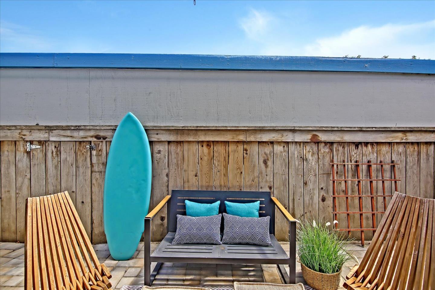 1925 46th Avenue, Unit 149 Capitola, CA 95010 - Photo 13 of 24 a couch sitting in a back yard of a house