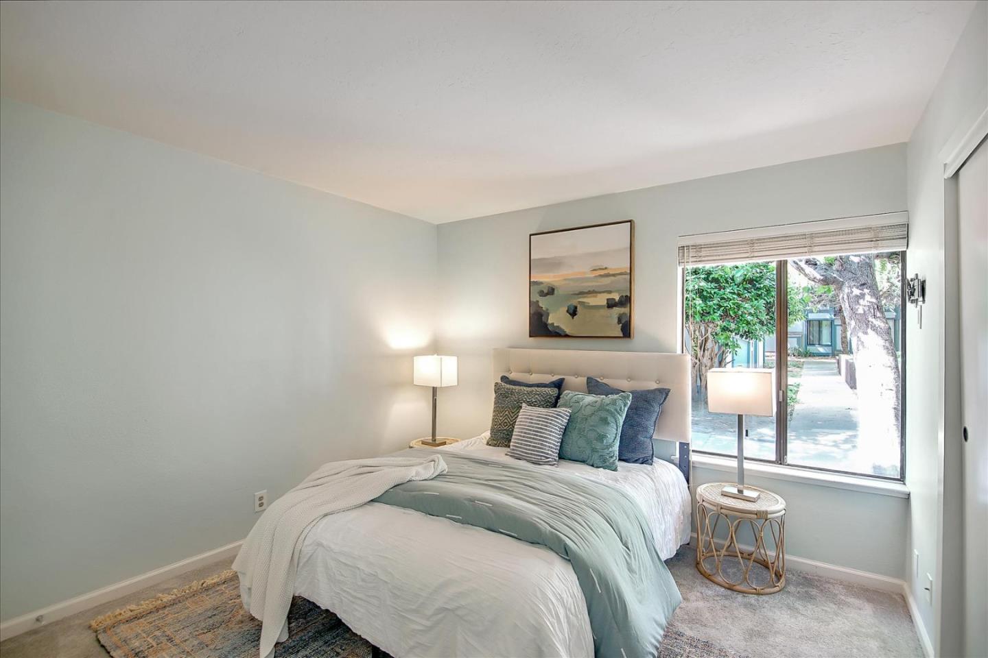 1925 46th Avenue, Unit 149 Capitola, CA 95010 - Photo 14 of 24 a bedroom with a bed and a window