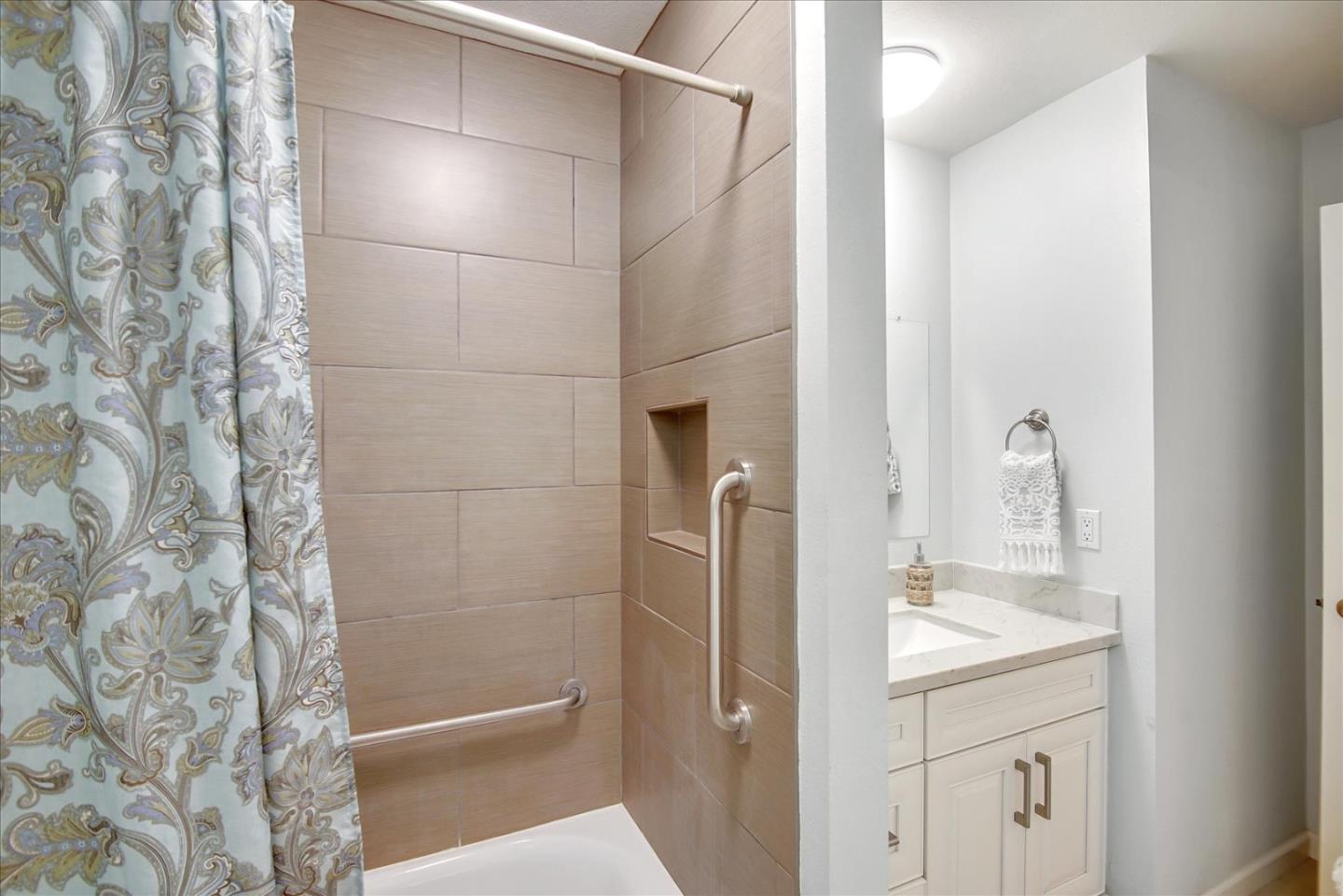 1925 46th Avenue, Unit 149 Capitola, CA 95010 - Photo 17 of 24 a bathroom with a shower and a sink
