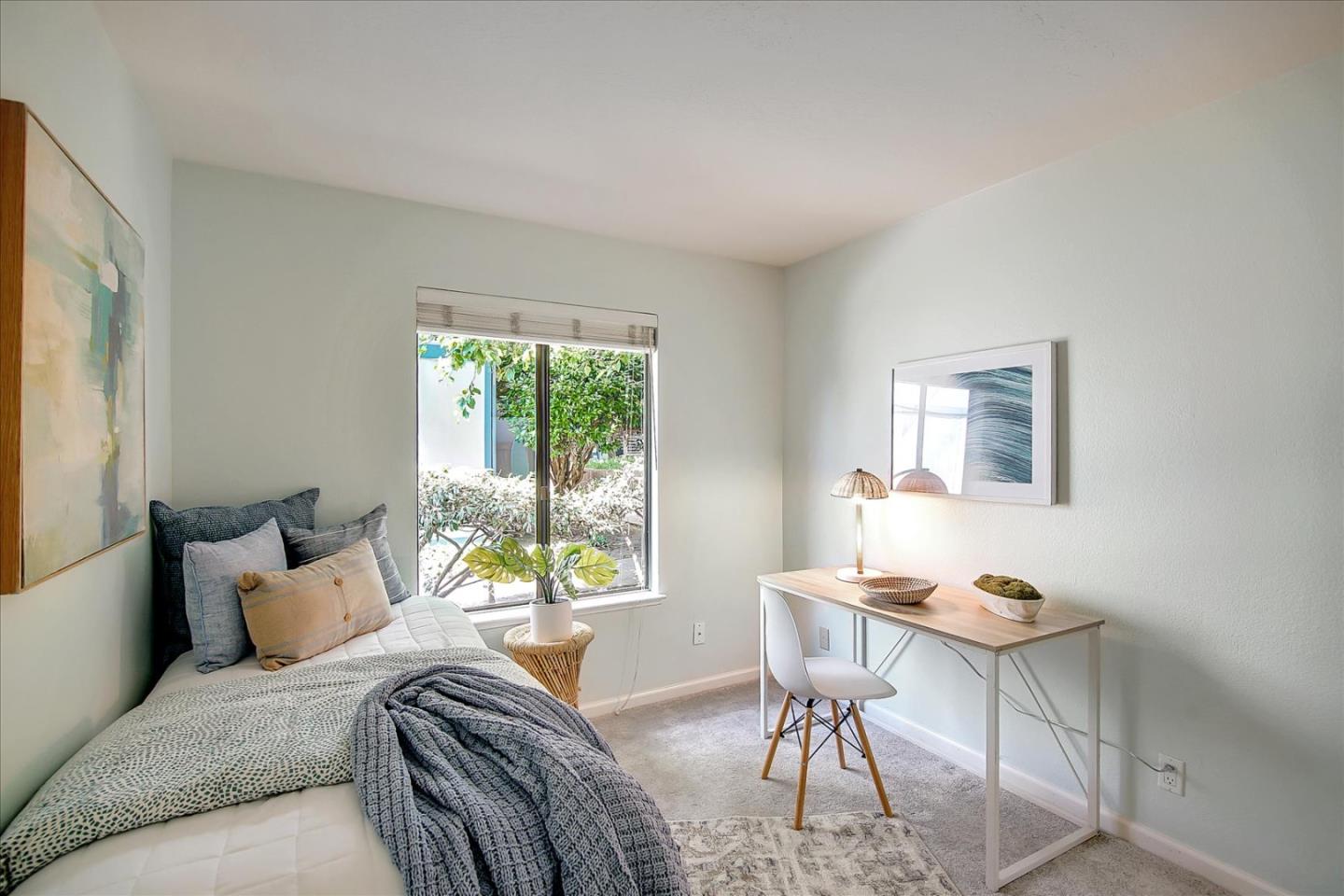 1925 46th Avenue, Unit 149 Capitola, CA 95010 - Photo 22 of 24 a bedroom with a bed and a window