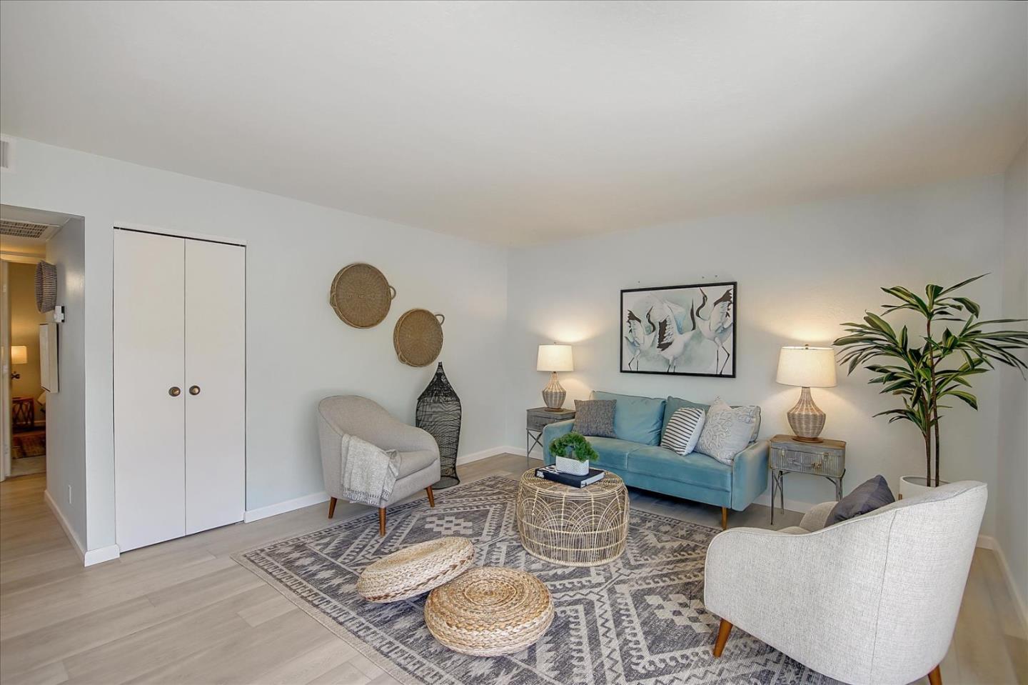 1925 46th Avenue, Unit 149 Capitola, CA 95010 - Photo 5 of 24 a living room with furniture and a potted plant