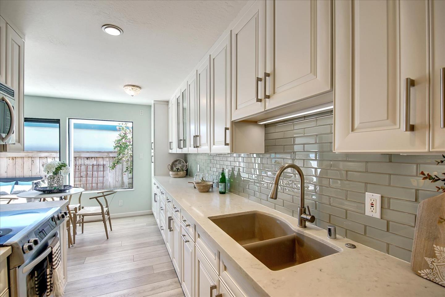 1925 46th Avenue, Unit 149 Capitola, CA 95010 - Photo 9 of 24 a kitchen with stainless steel appliances a sink stove and cabinets