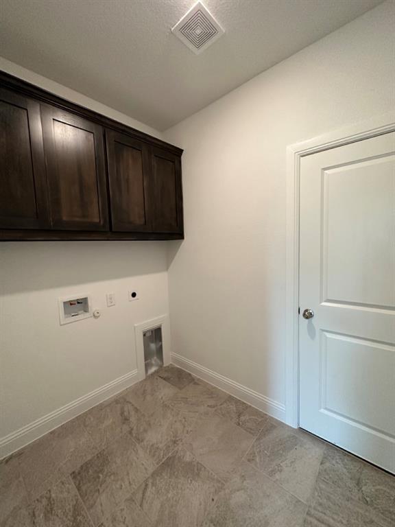 418 South 2nd Street Krum, TX 76249 - Photo 11 of 17 a view of an empty room and wooden floor