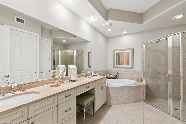 a bathroom with a sink double vanity shower and a mirror