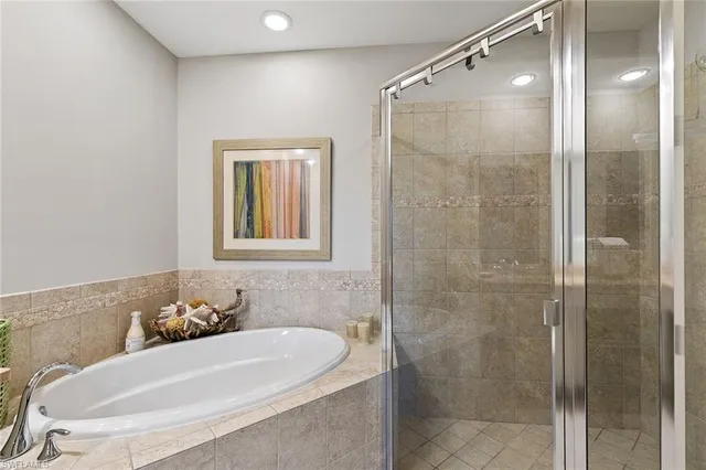 a bathroom with a bathtub and a shower