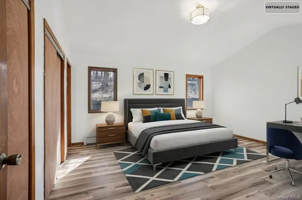 a bed room with a bed and a chair