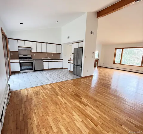 a view of a livingroom with wooden floor