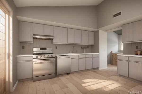 a kitchen with a sink stove and white cabinets