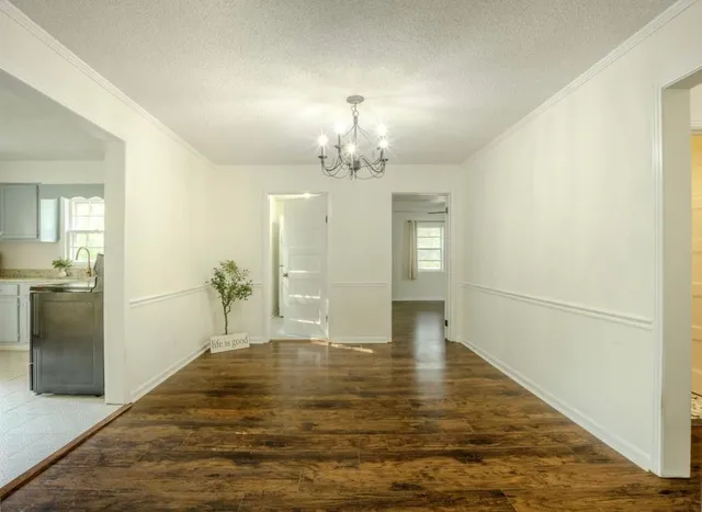 a view of a livingroom with wooden floor