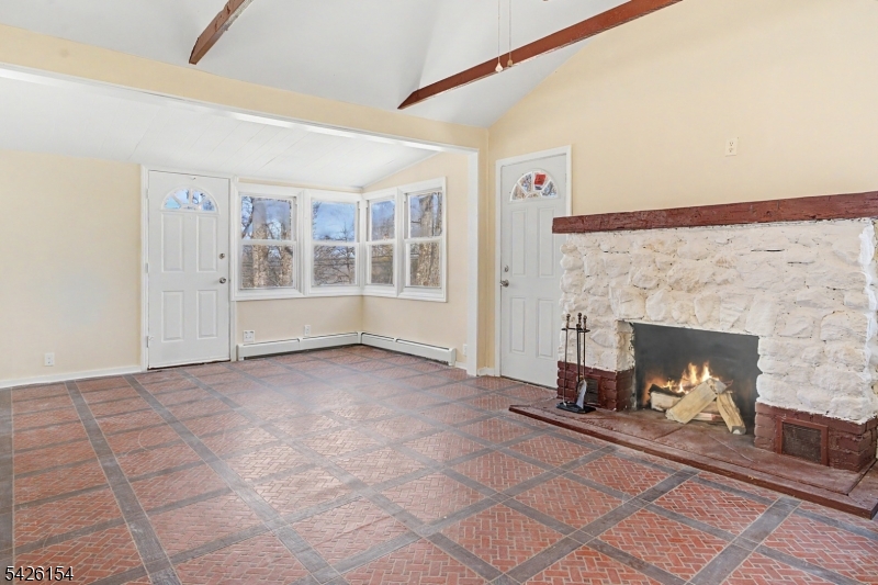 10 Berton Road Boonton, NJ 07005 - Photo 4 of 20 a view of a livingroom with a fireplace and window