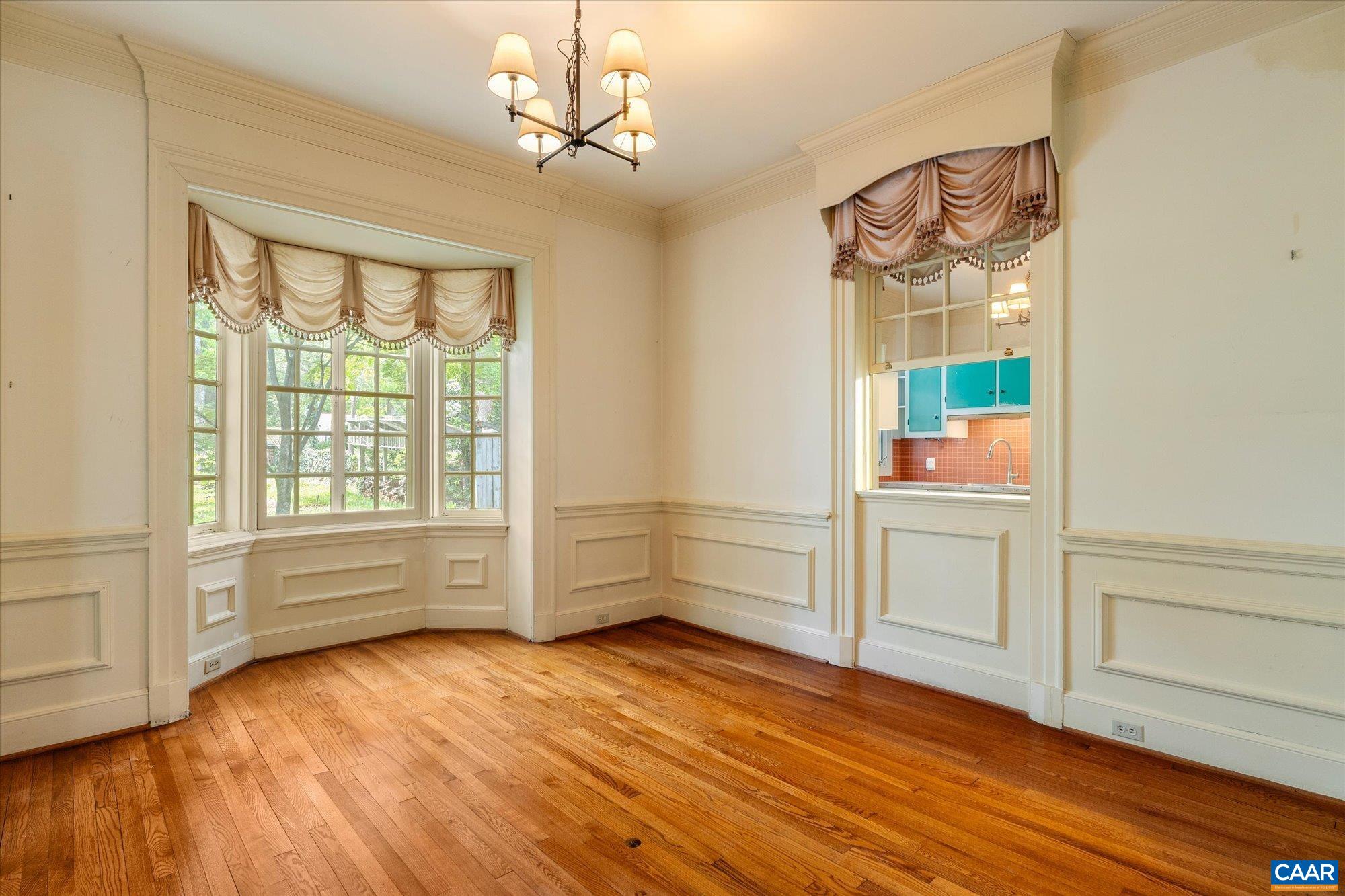 2001 Thomson Road Charlottesville, VA 22903 - Photo 14 of 54 an empty room with wooden floor and windows