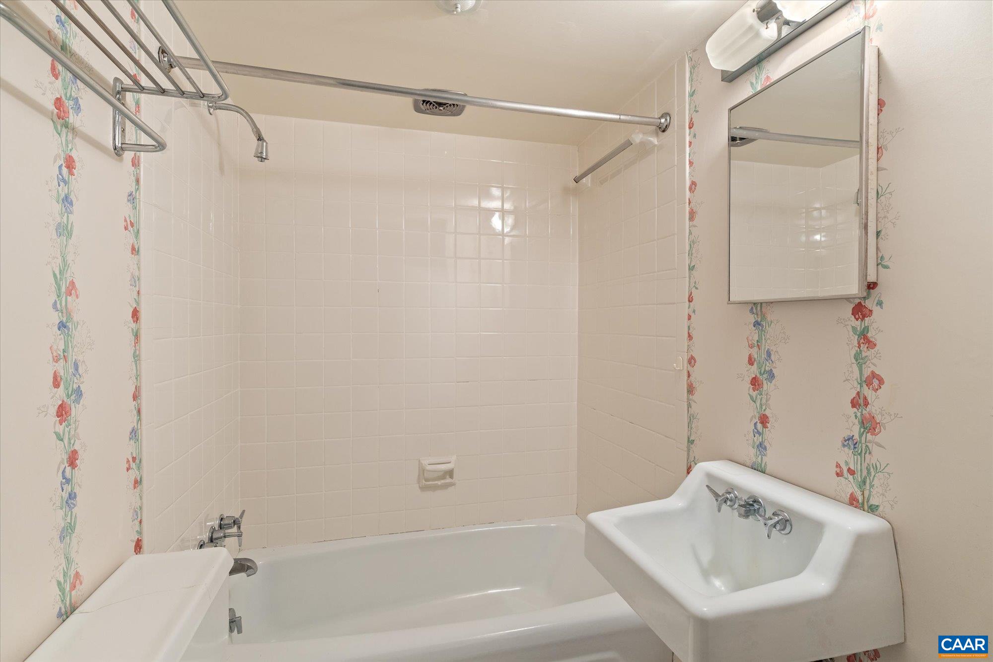 2001 Thomson Road Charlottesville, VA 22903 - Photo 35 of 54 a bathroom with a sink and shower