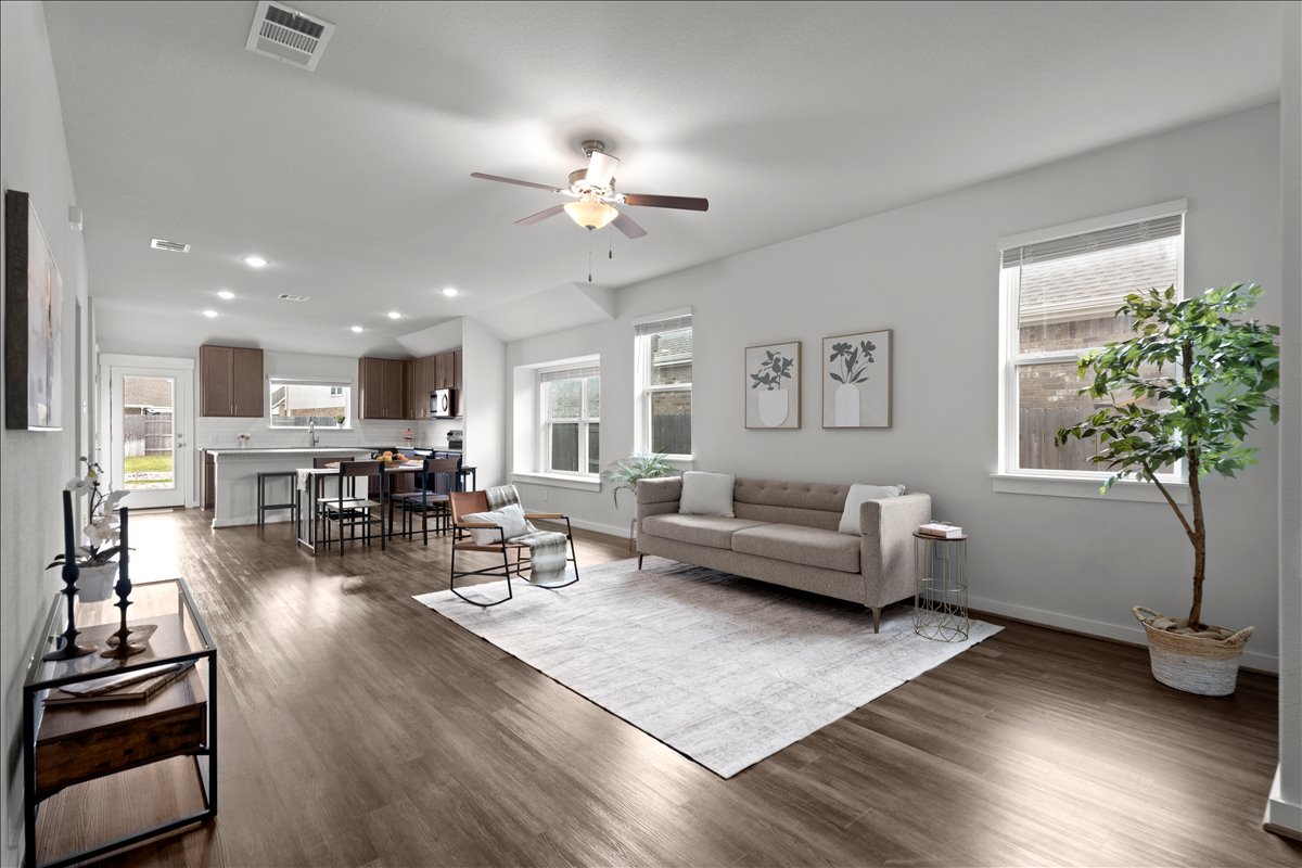 Open-concept living space and large windows providing natural light