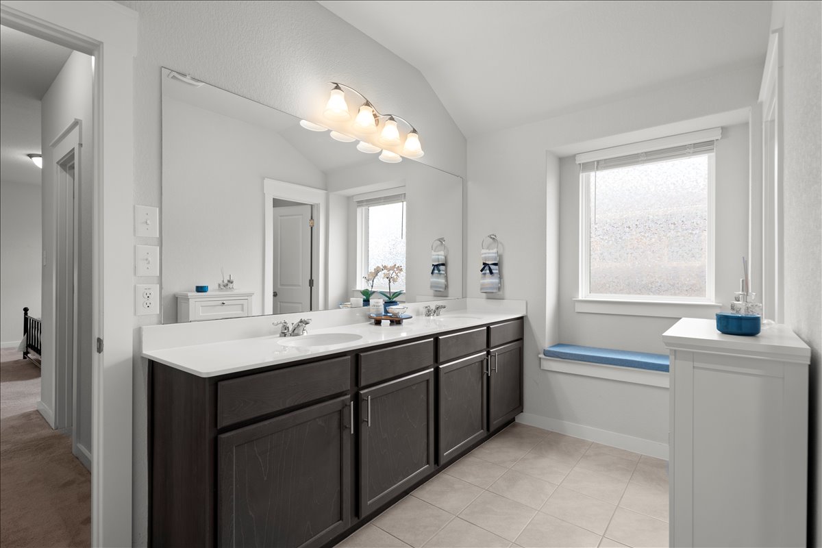 321 Buffalo View Lane Georgetown, TX 78628 - Photo 12 of 29 Features a double vanity and light-colored Quartz countertop