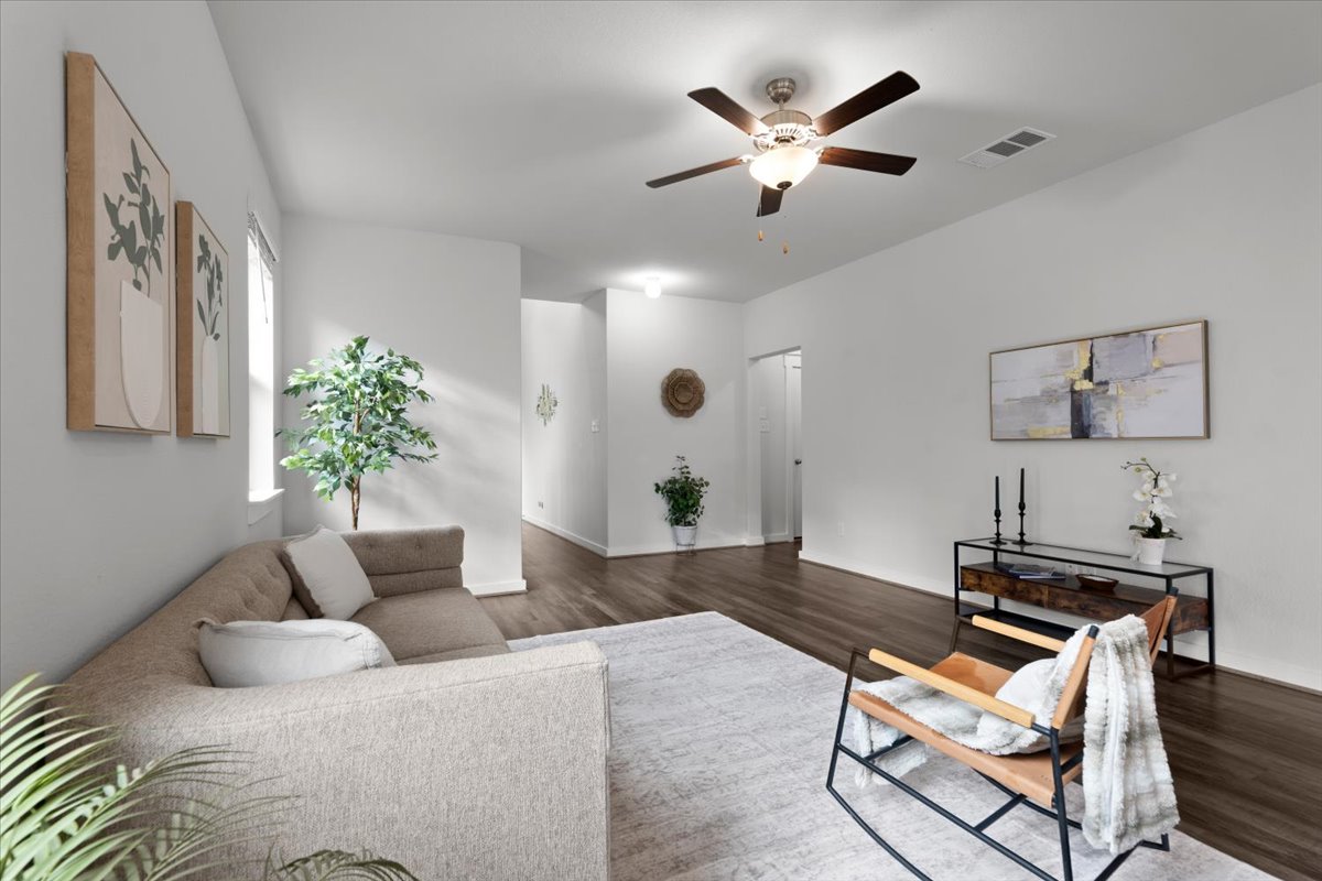 321 Buffalo View Lane Georgetown, TX 78628 - Photo 2 of 29 Lightly lived-in living area features a ceiling fan, light-colored walls