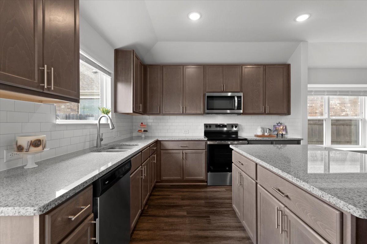321 Buffalo View Lane Georgetown, TX 78628 - Photo 8 of 29 A large sink overlooks the expansive backyard through a picture window