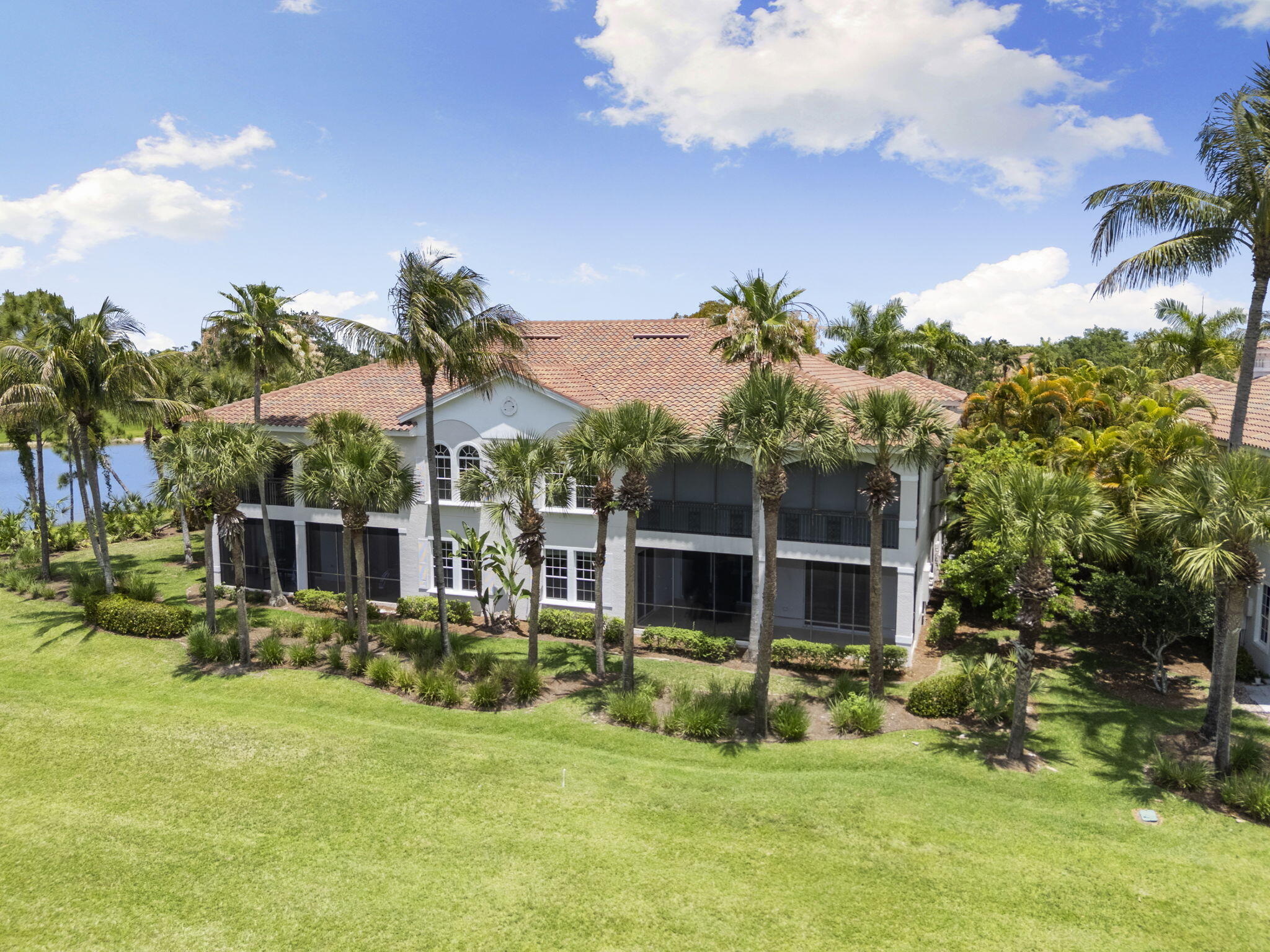 9066 Cascada Way, Unit 101 Naples, FL 34114 - Photo 36 of 51 a view of a house with a yard