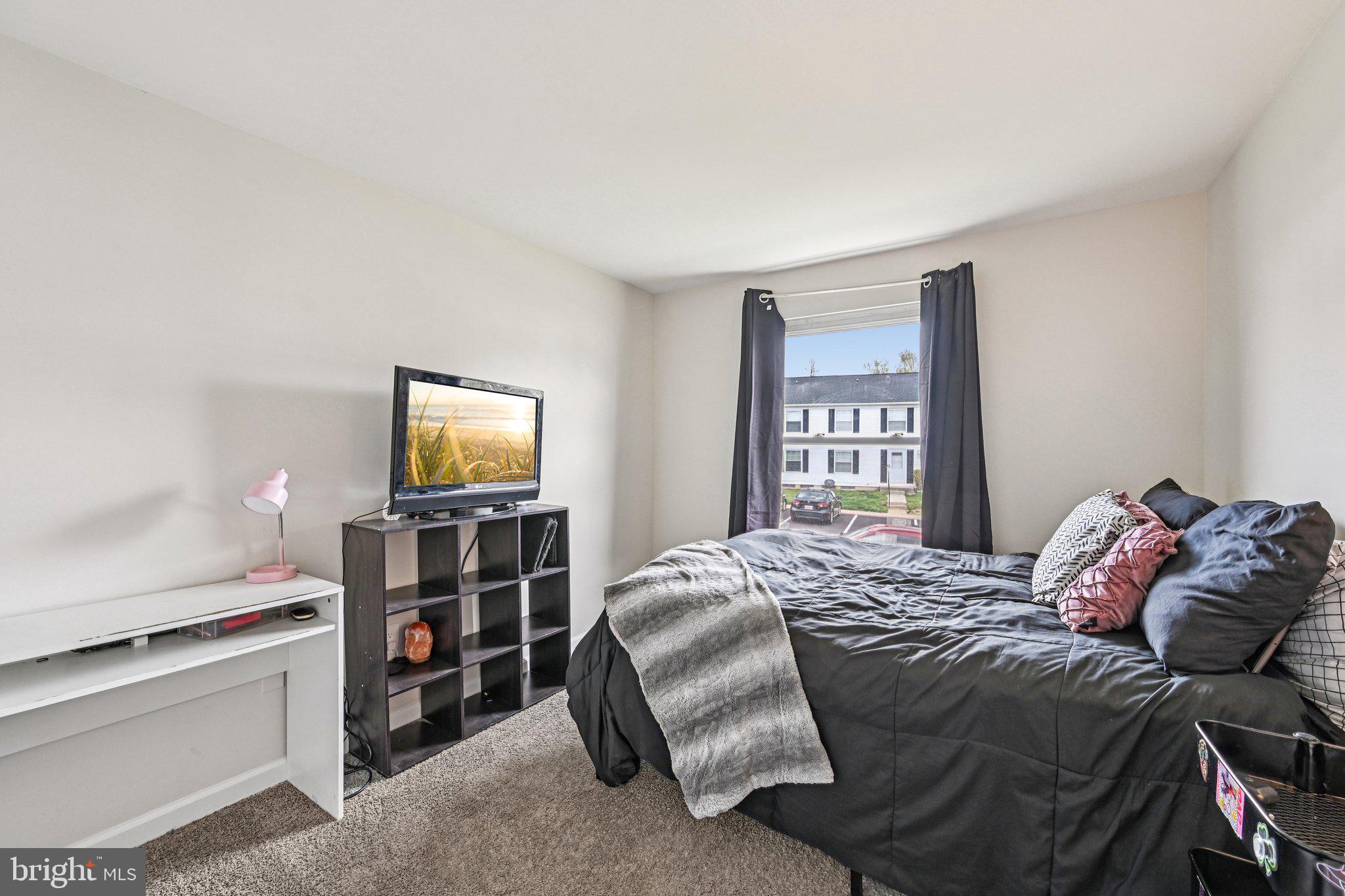 32 Coliston Road, Unit B Reisterstown, MD 21136 - Photo 16 of 24 a bedroom with a bed and a tv