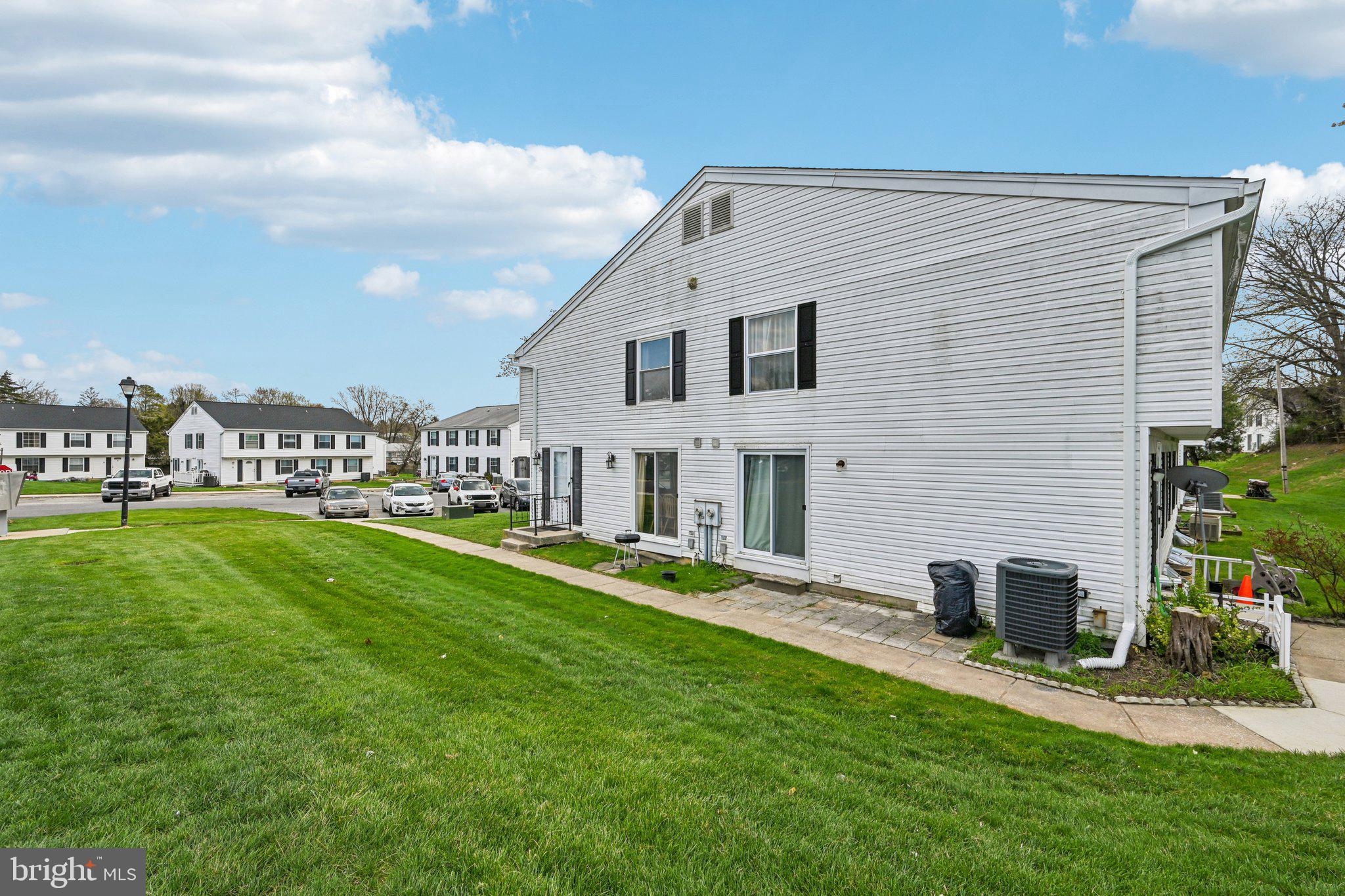 32 Coliston Road, Unit B Reisterstown, MD 21136 - Photo 2 of 24 a front view of a house with a yard