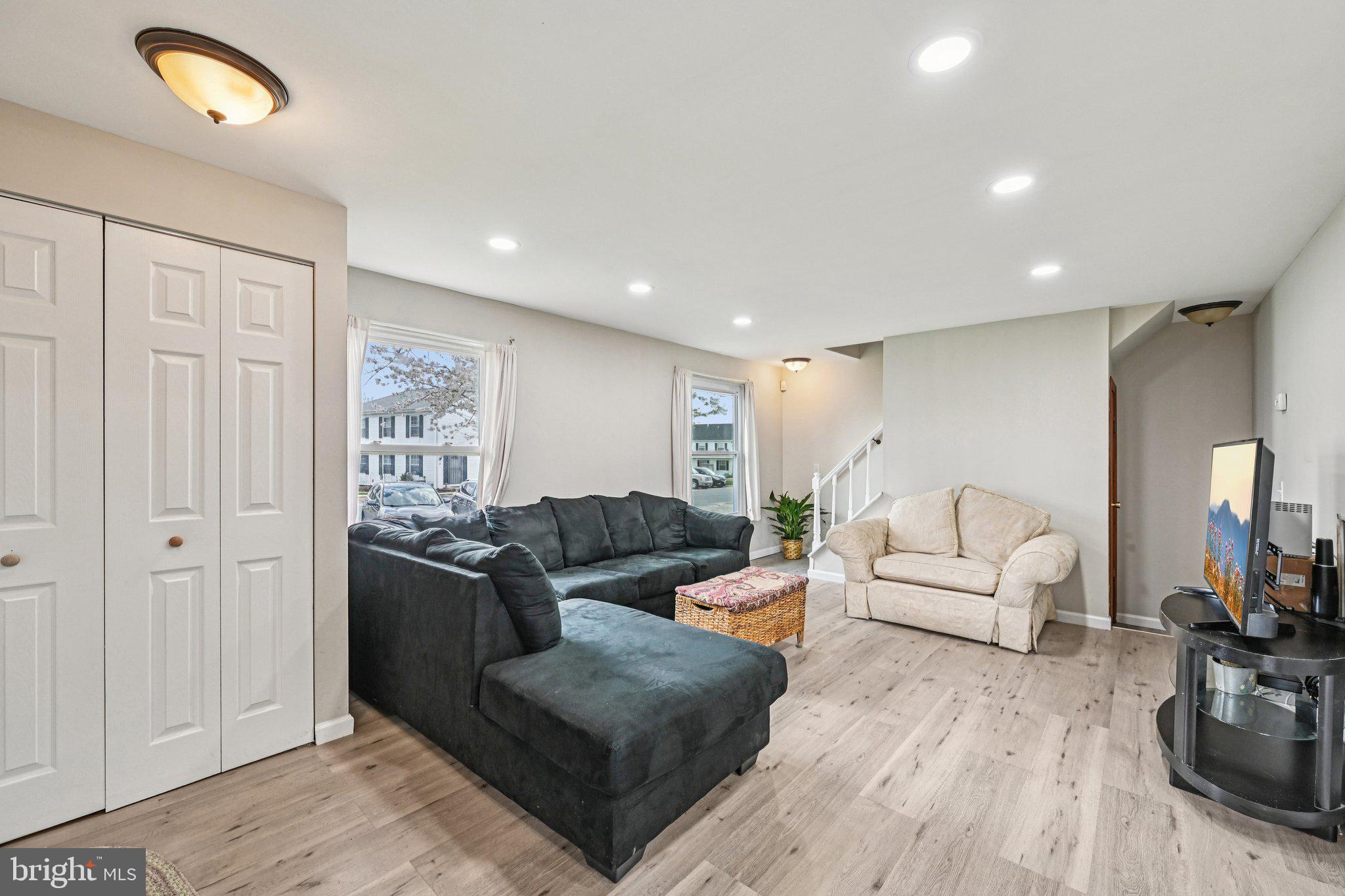 32 Coliston Road, Unit B Reisterstown, MD 21136 - Photo 4 of 24 a living room with furniture and a flat screen tv