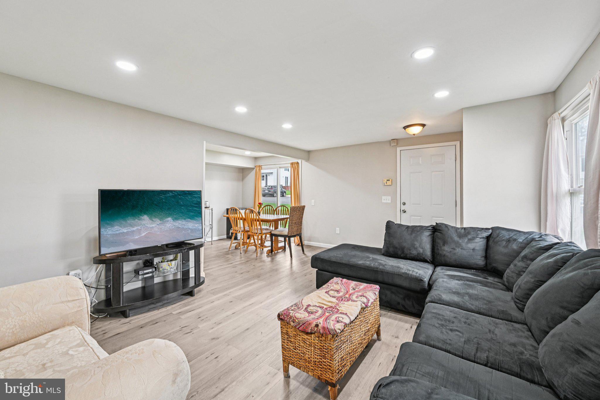 32 Coliston Road, Unit B Reisterstown, MD 21136 - Photo 6 of 24 a living room with furniture and a flat screen tv