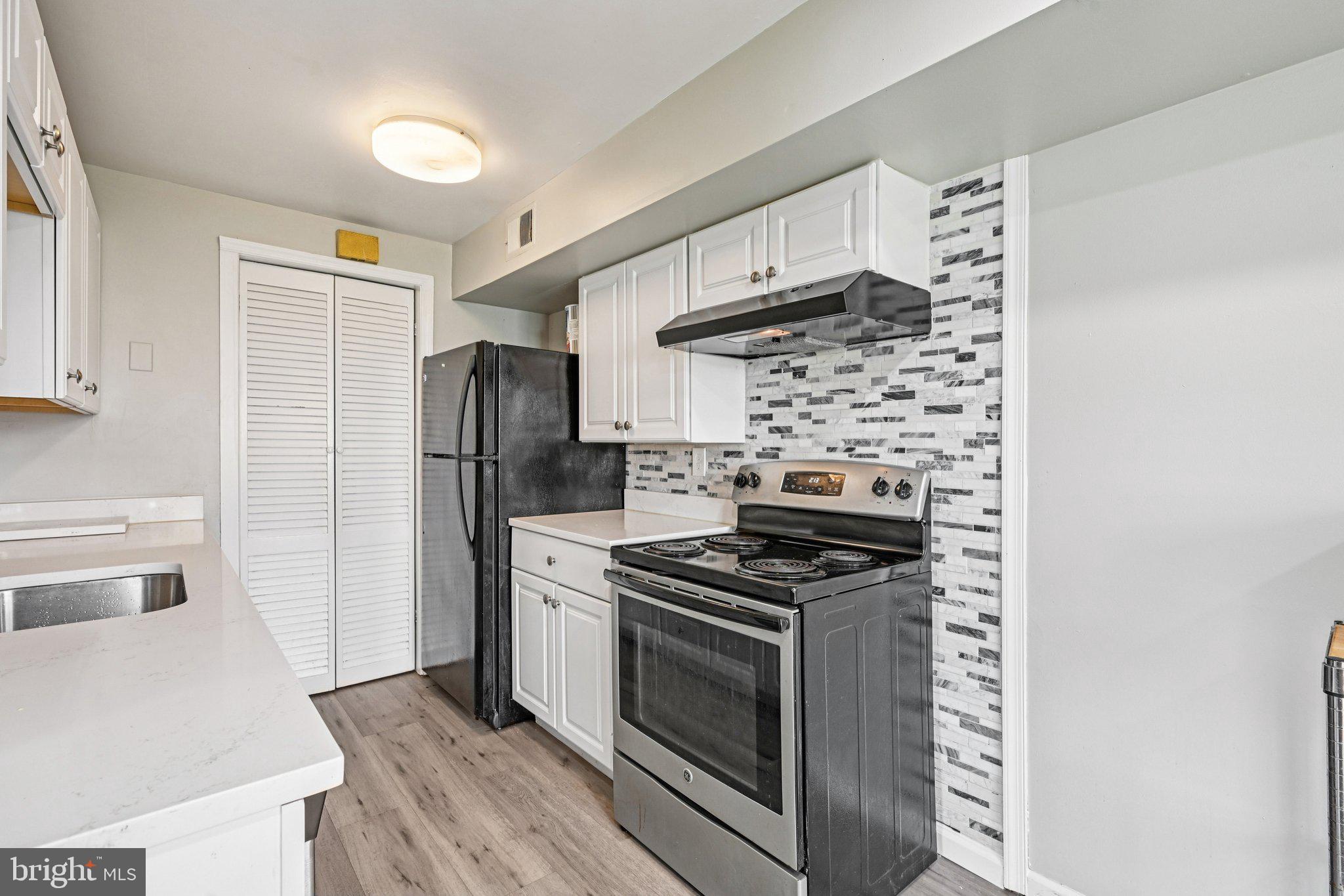 32 Coliston Road, Unit B Reisterstown, MD 21136 - Photo 10 of 24 a kitchen with cabinets and steel stainless steel appliances