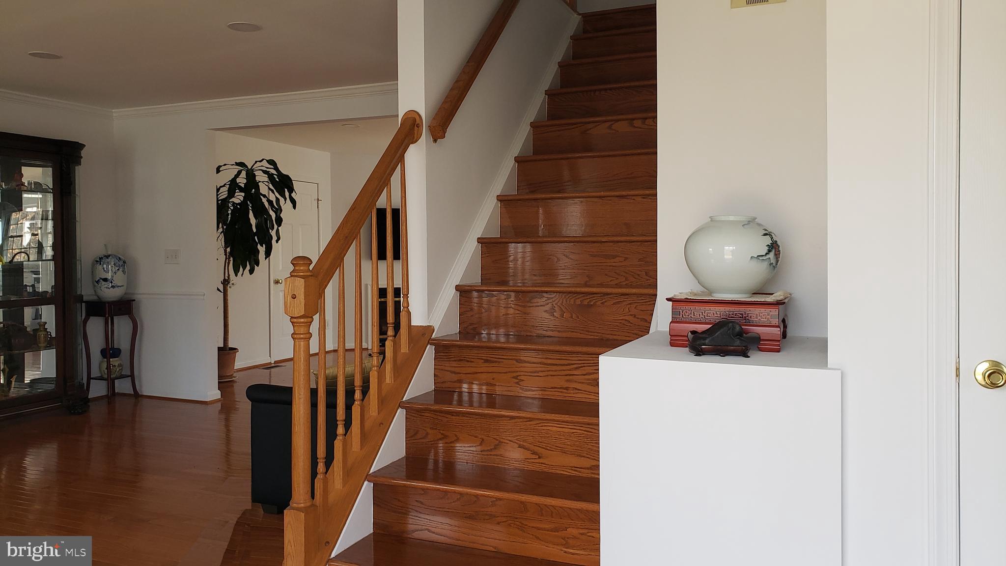 21 Hoy Road Stafford, VA 22556 - Photo 9 of 17 Hardwood stairs to upper level