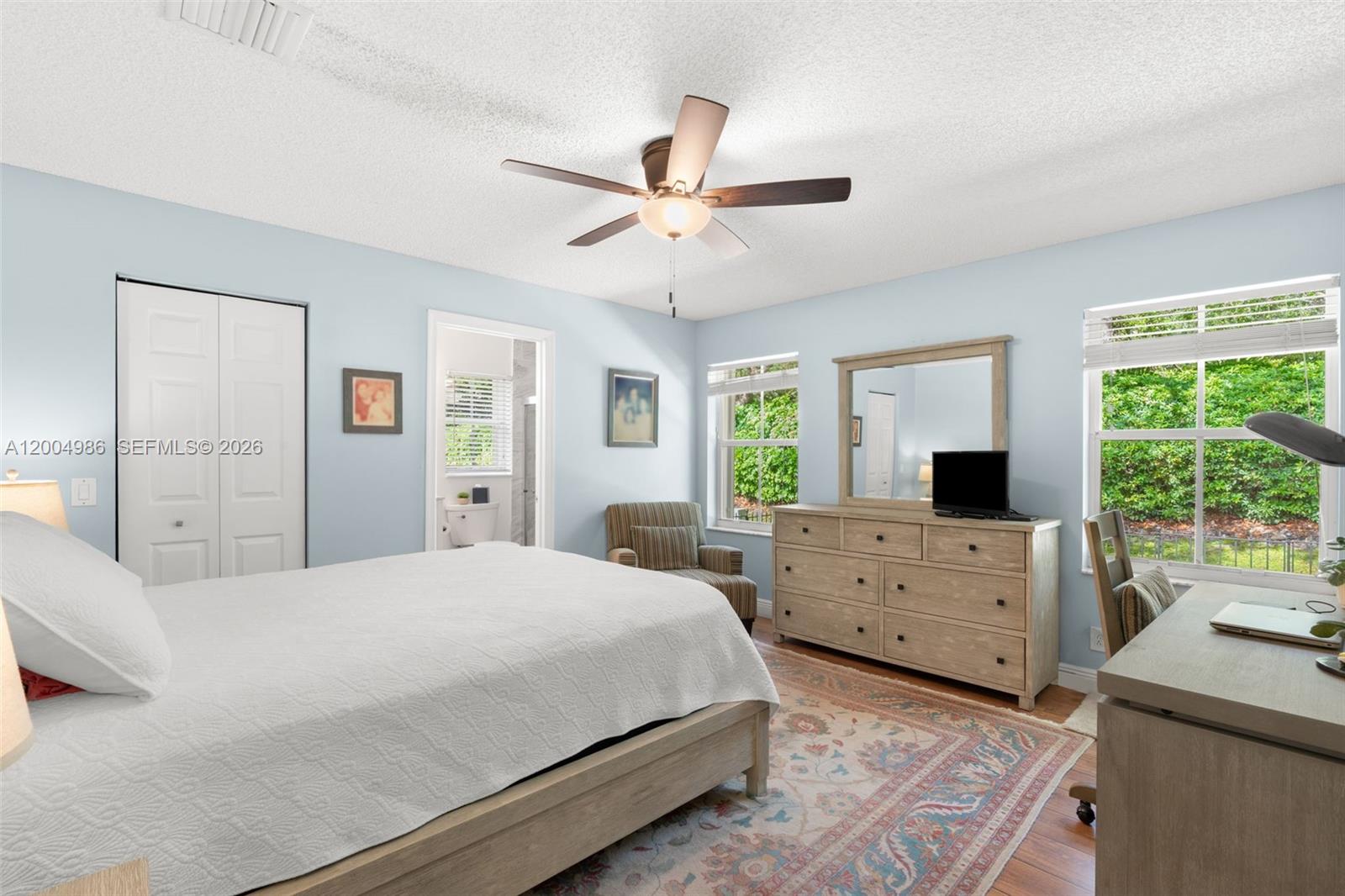 4108 Pine Ridge Lane Weston, FL 33331 - Photo 18 of 37 a bedroom with a bed and a dresser