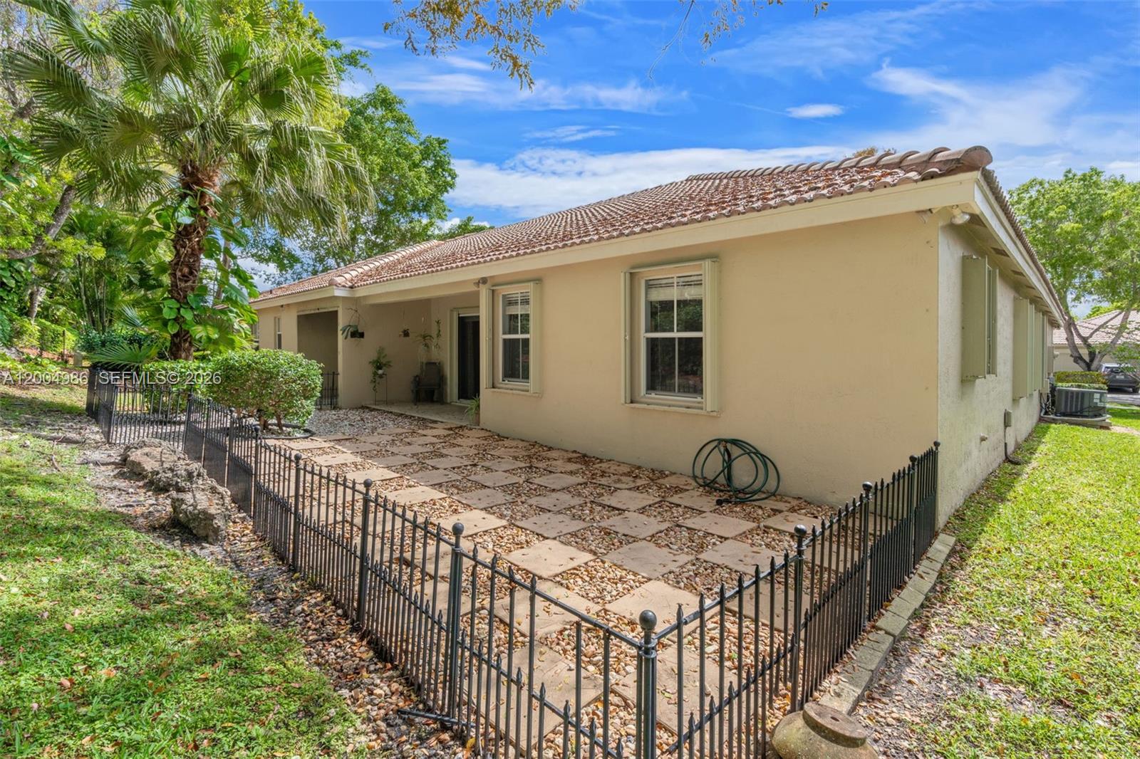 4108 Pine Ridge Lane Weston, FL 33331 - Photo 27 of 37 a view of a house with wooden fence