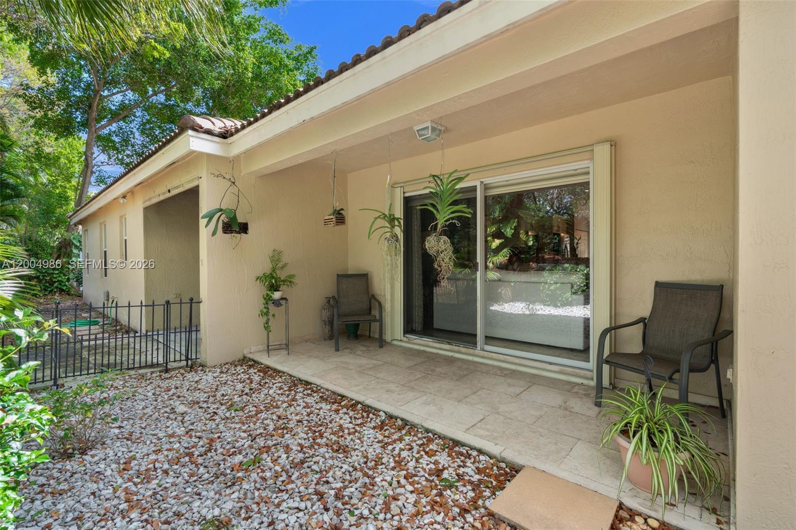 4108 Pine Ridge Lane Weston, FL 33331 - Photo 28 of 37 a backyard of a house with seating space