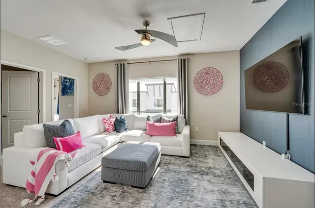 a living room with furniture and a window