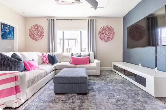 a living room with furniture and a window