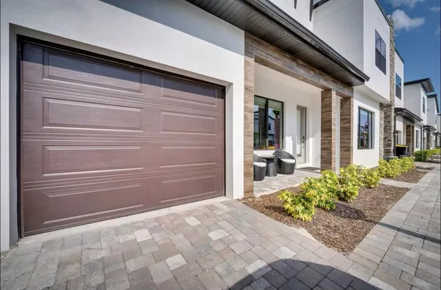 a view of a house with a door and wooden floor