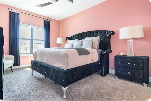 a spacious bedroom with a bed and window