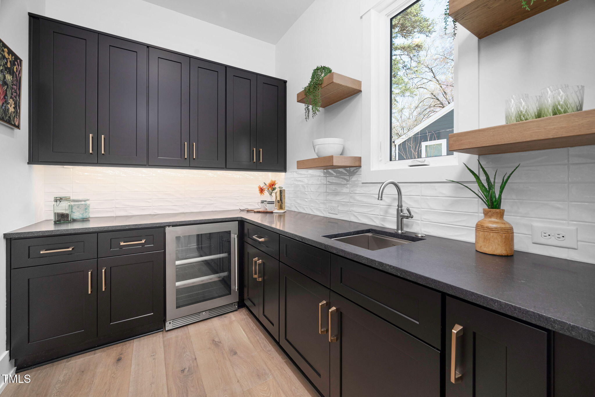 604 Edmund Street Raleigh, NC 27604 - Photo 13 of 70 a kitchen with a sink and cabinets