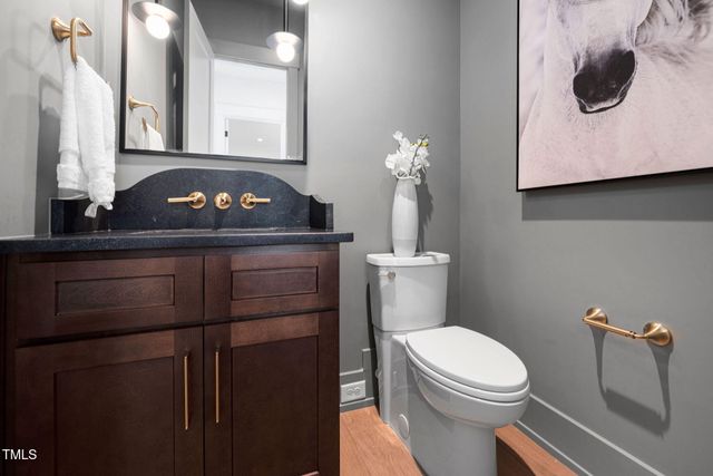 a view of a livingroom with furniture and wooden floor