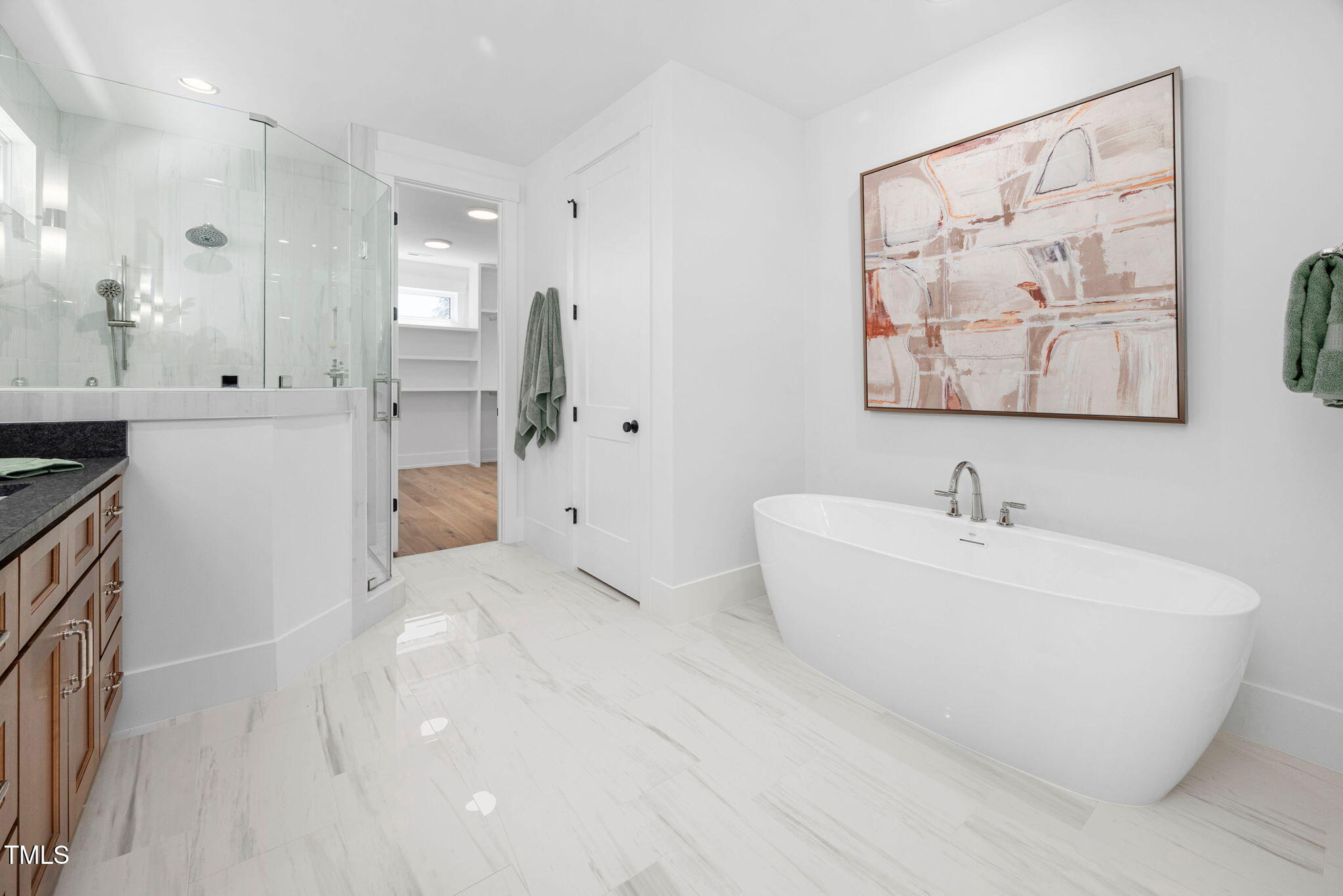 604 Edmund Street Raleigh, NC 27604 - Photo 23 of 70 a bathroom with a bathtub and a sink