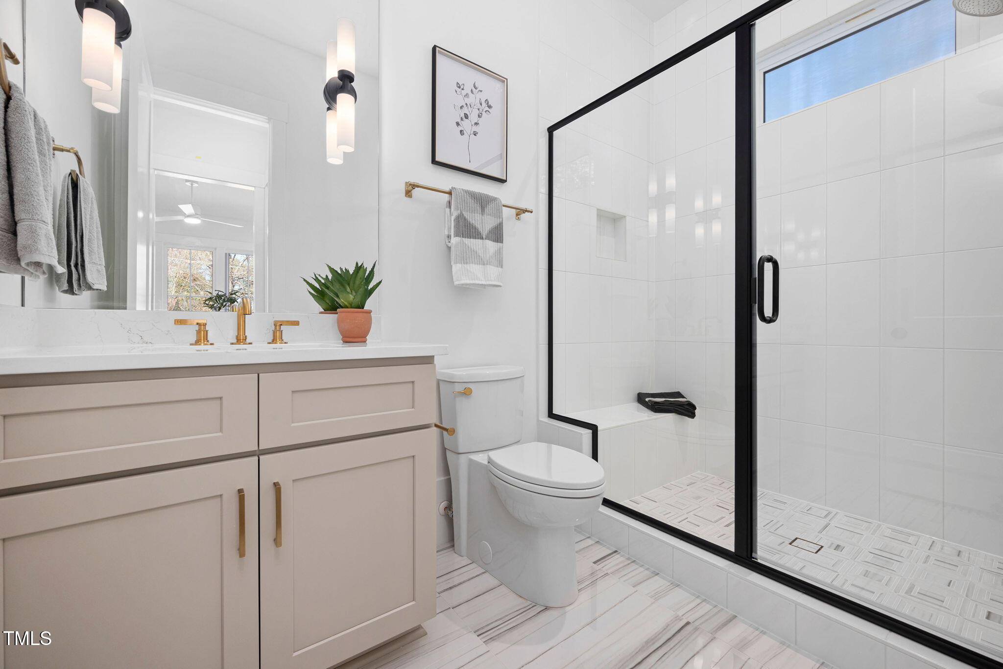 604 Edmund Street Raleigh, NC 27604 - Photo 31 of 70 a bathroom with a shower sink and toilet