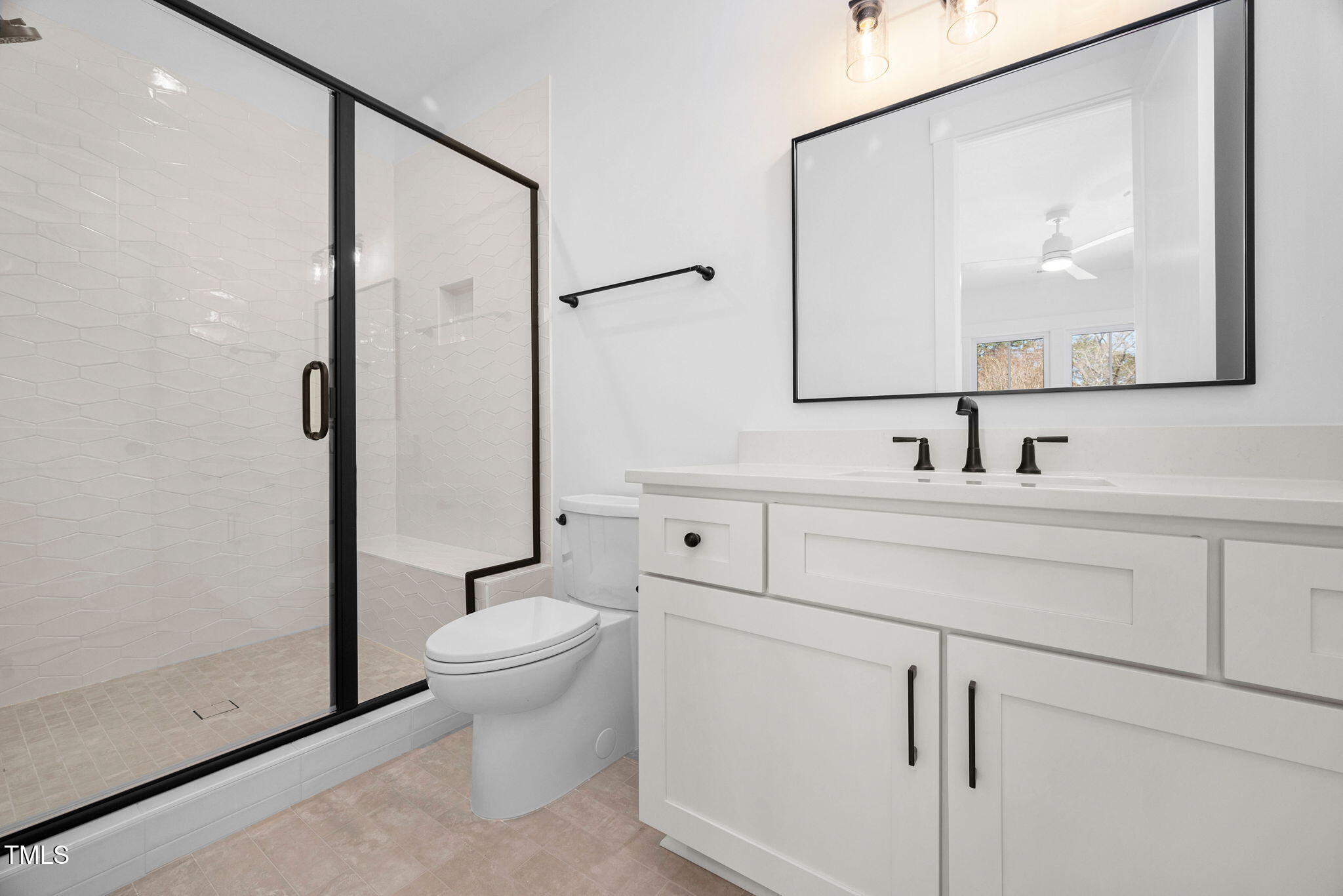 604 Edmund Street Raleigh, NC 27604 - Photo 36 of 70 a bathroom with a toilet sink and mirror