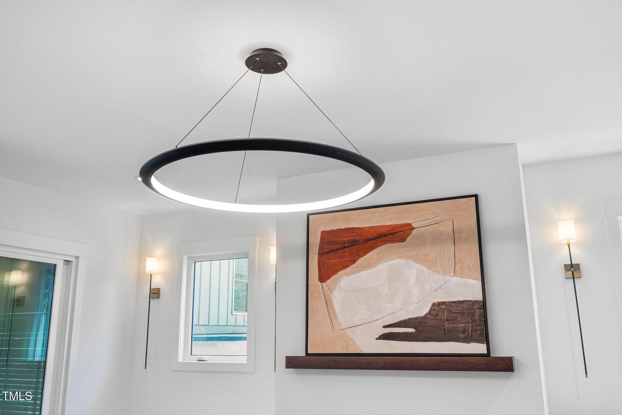 604 Edmund Street Raleigh, NC 27604 - Photo 43 of 70 a view of a hallway with a painting on the wall