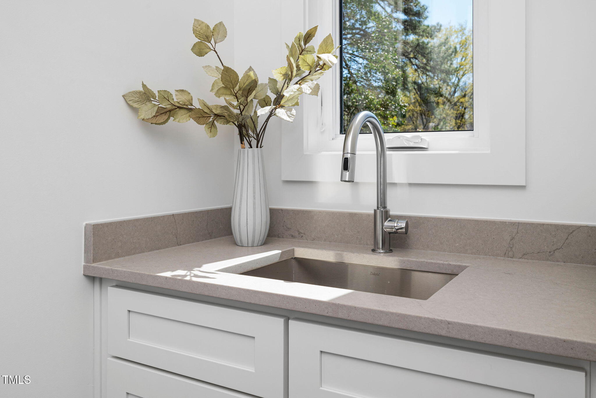 604 Edmund Street Raleigh, NC 27604 - Photo 50 of 70 a close view of sink and tap