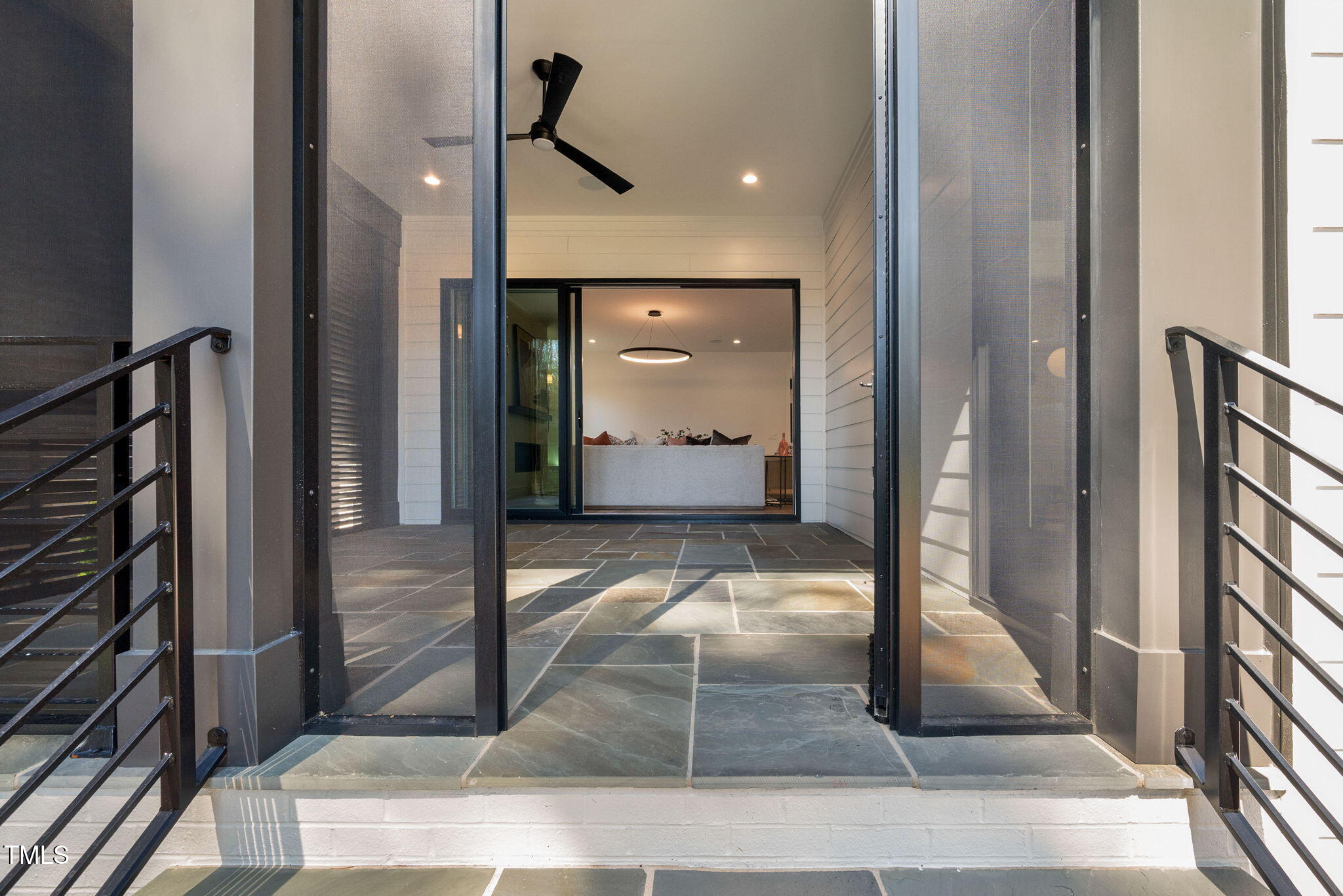 604 Edmund Street Raleigh, NC 27604 - Photo 60 of 70 a view of a hallway with a living room filled with furniture