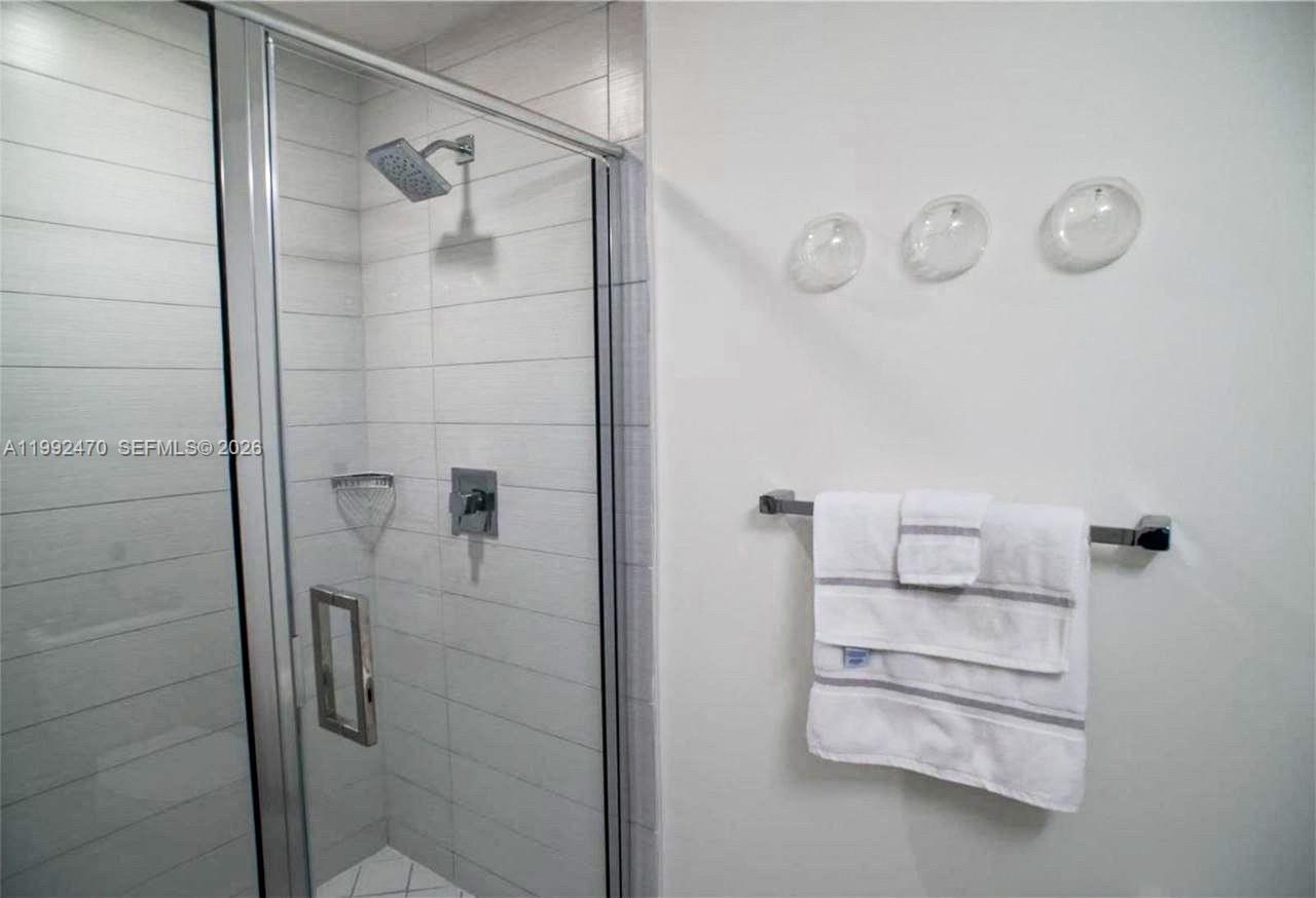 999 Southwest 1st Avenue, Unit 3208 Miami, FL 33130 - Photo 8 of 14 a bathroom with a shower
