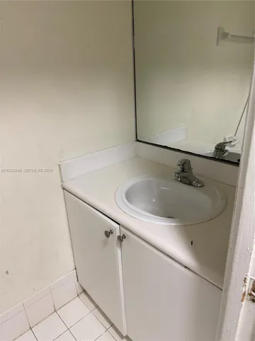 a bathroom with a sink and vanity