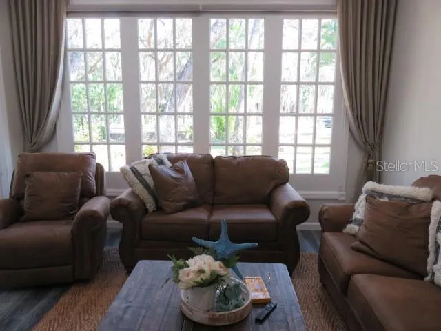 a living room with furniture and a large window