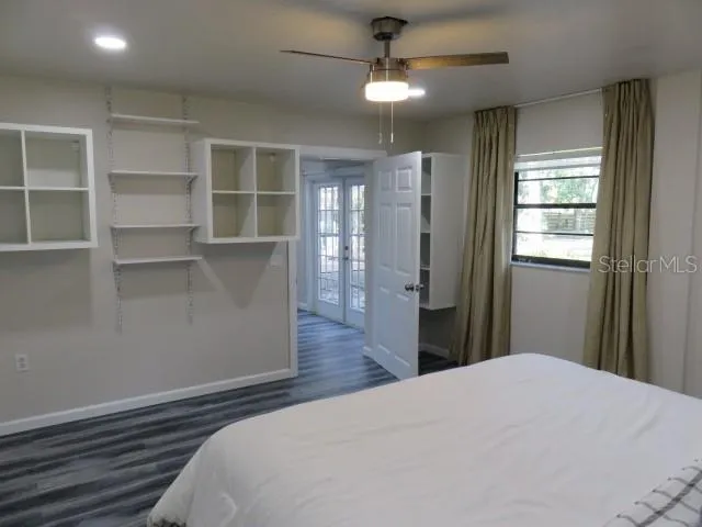 a bedroom with furniture and a window