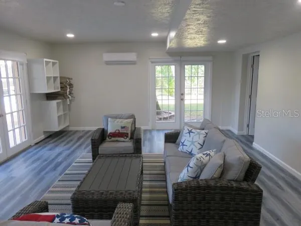 a view of a patio with table and chairs under an umbrella