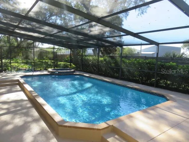 a kitchen with granite countertop a sink stove and cabinets
