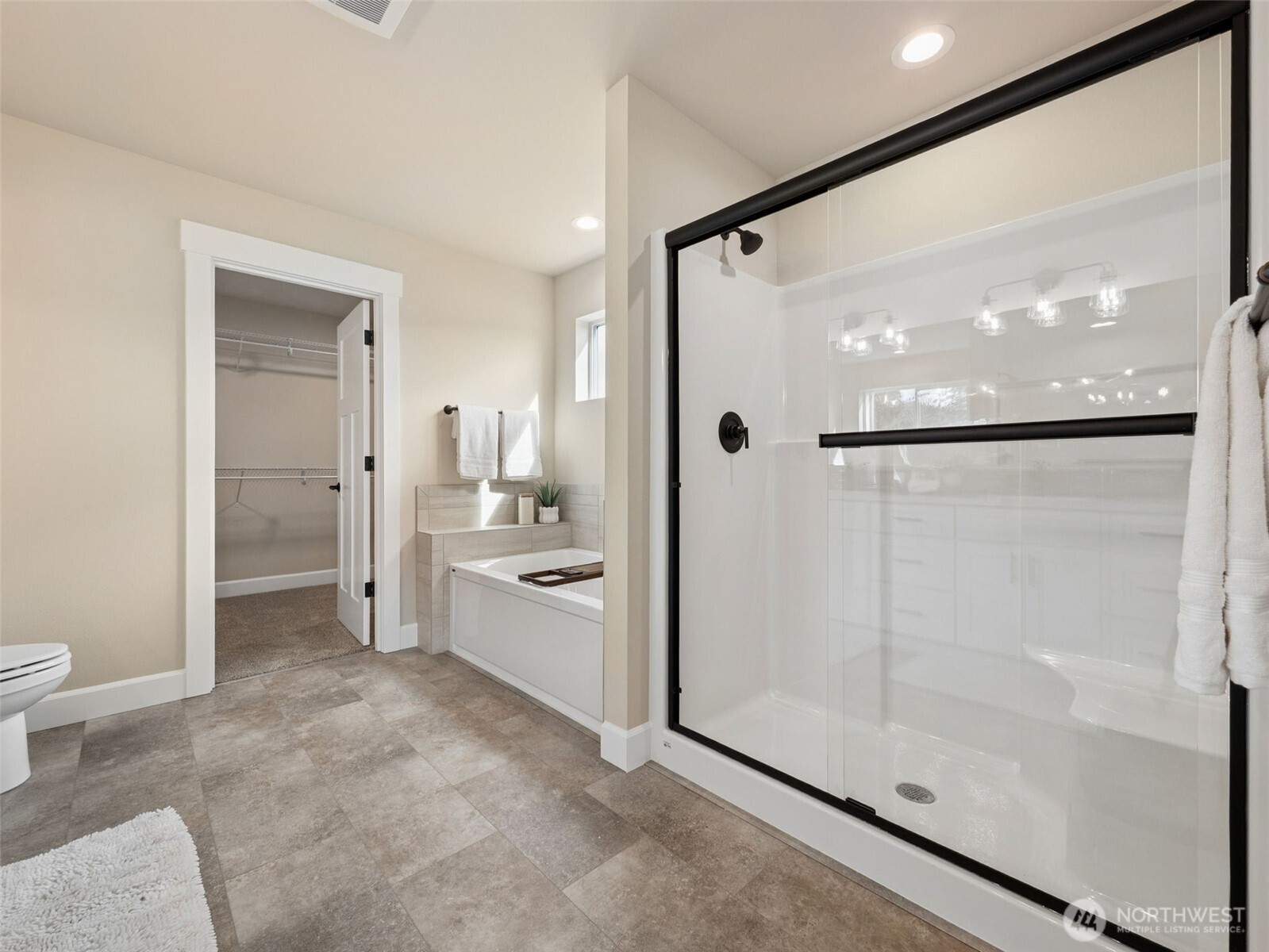 1742 Fieldcrest Place Buckley, WA 98321 - Photo 15 of 27 a bathroom with a glass shower door